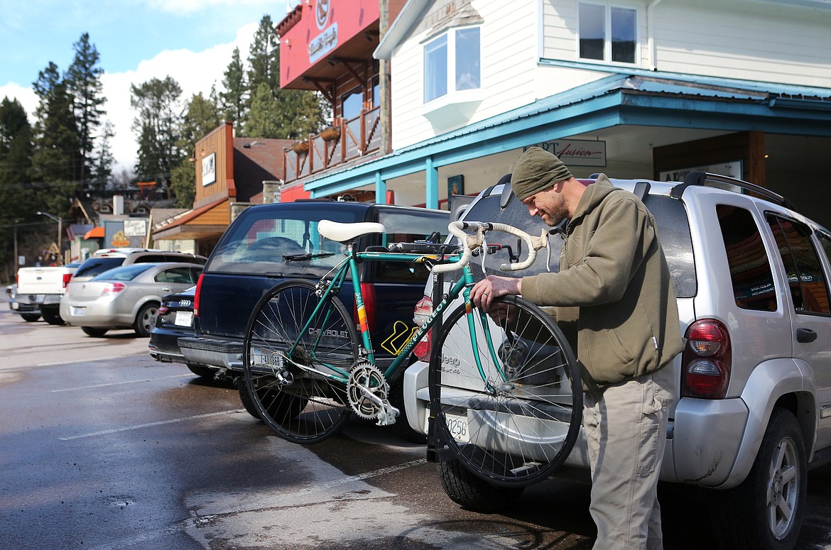 Tom Gibson completes a tune-up on a 1980s Peugeot road bike in downtown Bigfork on Thursday, April 23. (Mackenzie Reiss/Bigfork Eagle)