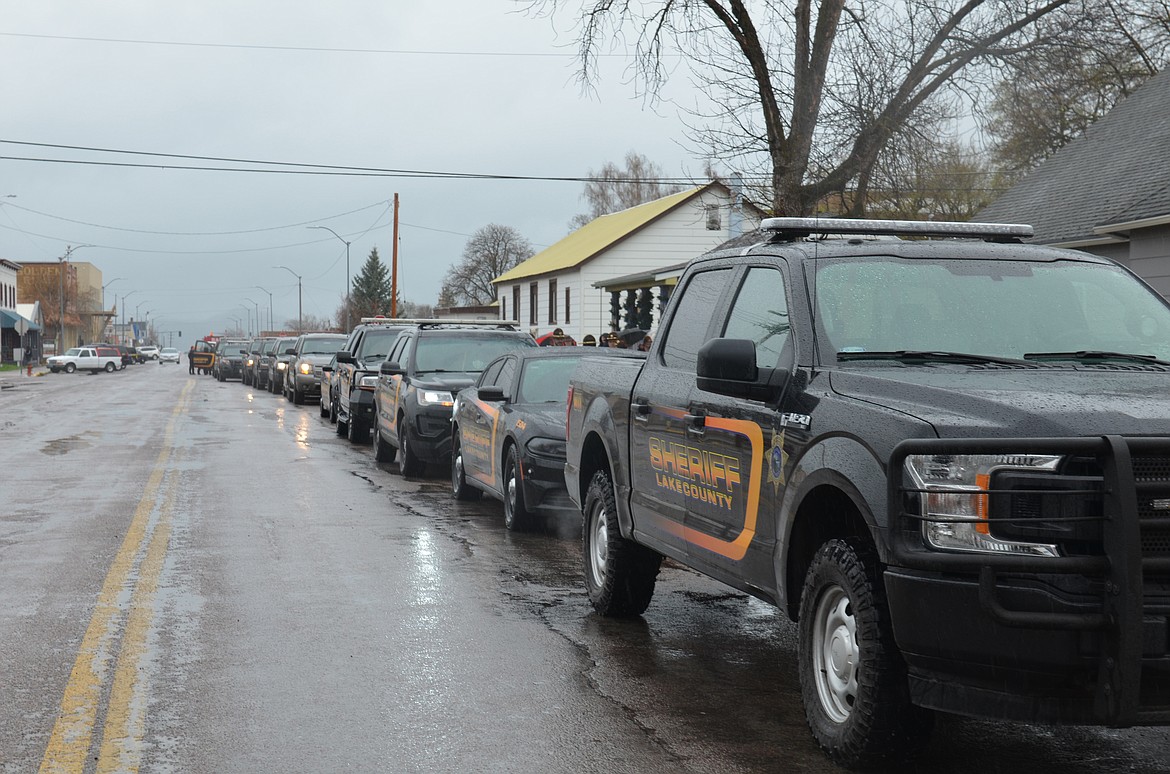 Law enforcement personnel from across the state join in a memorial procession on April 23 for Lake County Sheriff's Office Deputy Ross Holcomb, who died April 3 at his home in Ronan. Services were held after the procession via live stream from New Life Church in Polson. A burial with military honors will be held at the Bigfork Community Cemetery this summer. Deputy Holcomb had served with the Lake County Sheriff’s Department since 2017. (Emily Lonnevik/Lake County Leader)