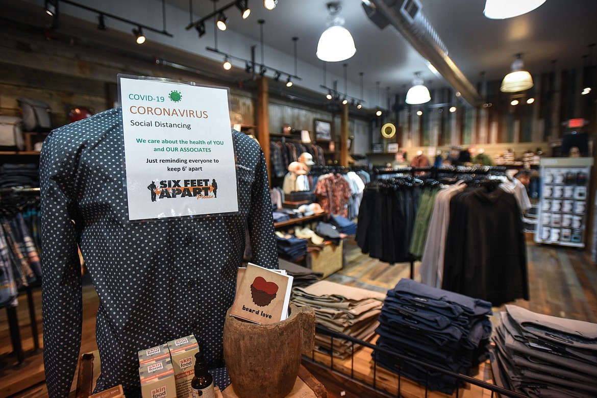 Signs promoting social distancing are displayed throughout The Toggery in Whitefish on Wednesday, April 29. (Casey Kreider/Daily Inter Lake)