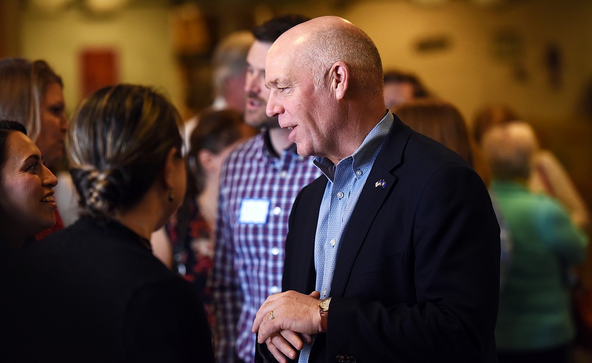 Rep. Greg Gianforte speaks with visitors before the Chamber of Commerce event on Thursday, May 3, at the Daily Inter Lake in Kalispell. 
 (Brenda Ahearn/Daily Inter Lake)