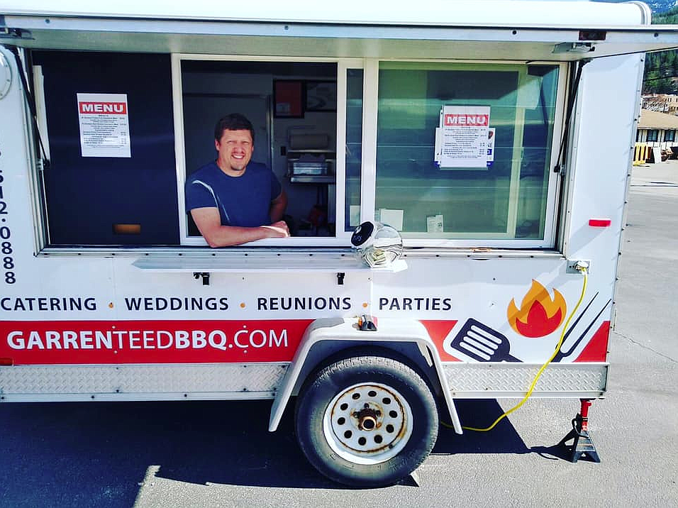 Courtesy photo 
 Garren Tayler ready to serve inside Garrenteed BBQ. The barbecue trailer also plans to have rotating specials and an updated menu that will be announced on their Facebook page.