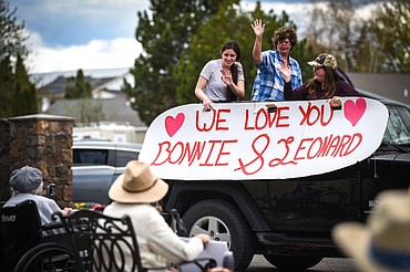 Family members wave to residents during a drive-by parade for Mother's Day at Prestige Assisted Living at Kalispell on Friday, May 8. (Casey Kreider/Daily Inter Lake)