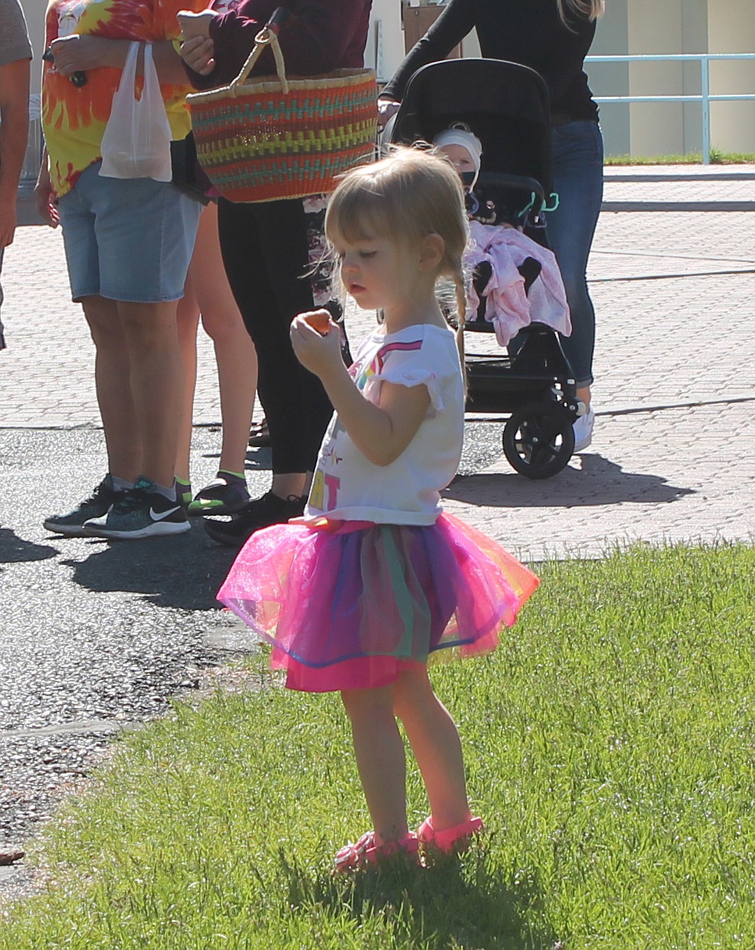 Hayden Brown, almost 3, enjoys a donut at the Moses Lake Farmers Market Saturday.