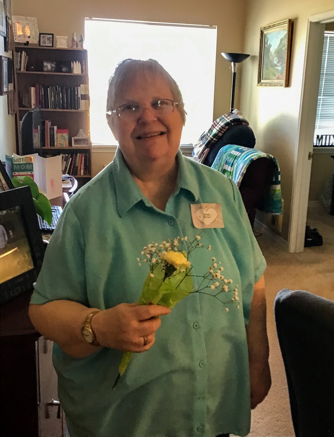 Courtesy photo 
 Betty, a resident and mother at Avamere at Moses Lake assisted-living facility, receives flowers in her room on Sunday afternoon.