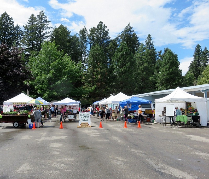 Vendors sell their wares at the Bigfork Farmers Market during summer 2019 (courtesy photos).