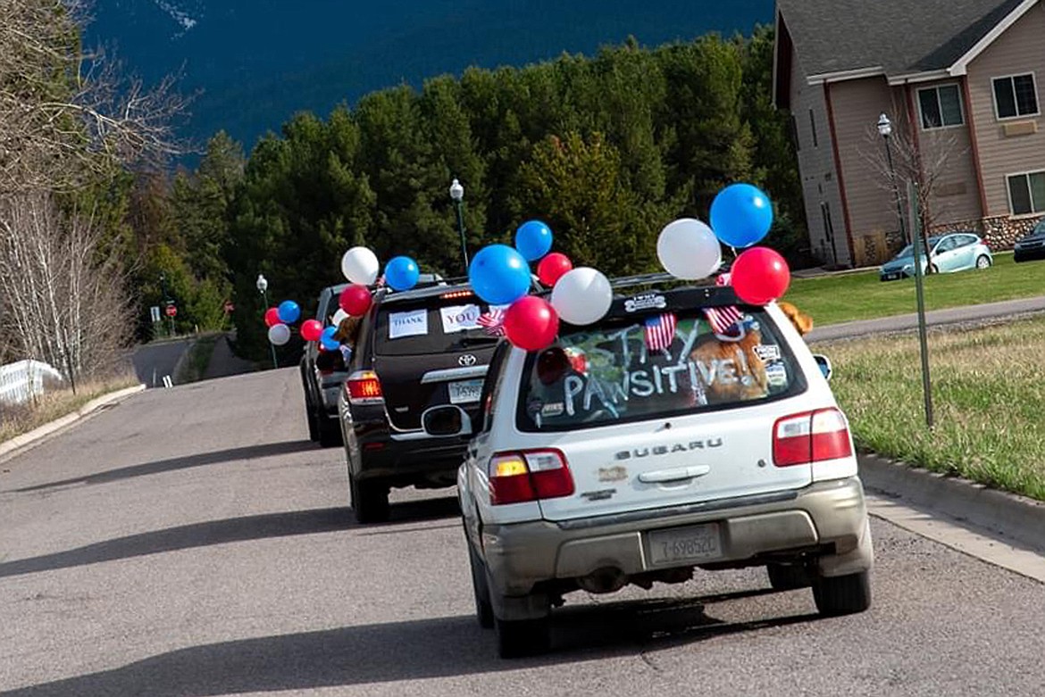 Vehicles drive between North Valley Hospital and The Springs at Whitefish during a recent parade held by Goldenstock Whitefish to thank workers on the frontline of the COVID-19 pandemic. (Photo courtesy Brian Kelley)