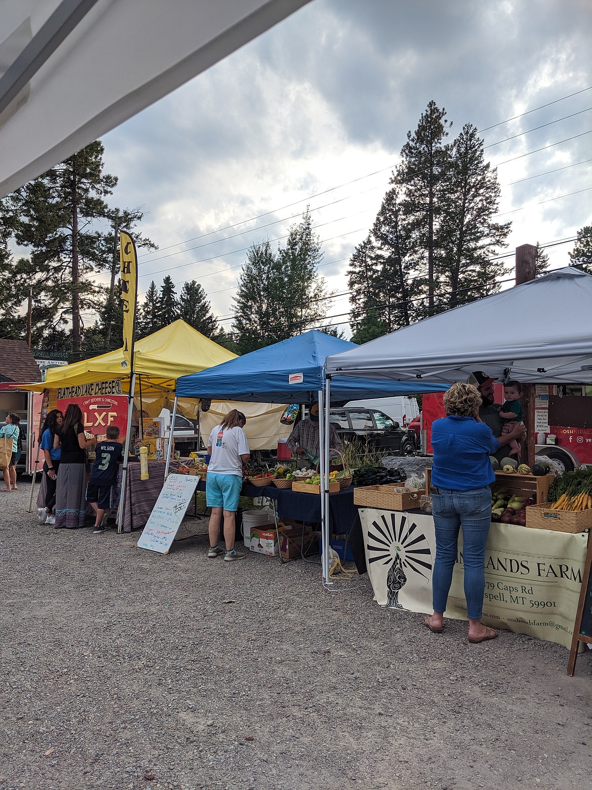 Shoppers check out their options at the Bigfork Village Market during summer 2020 (courtesy photos).