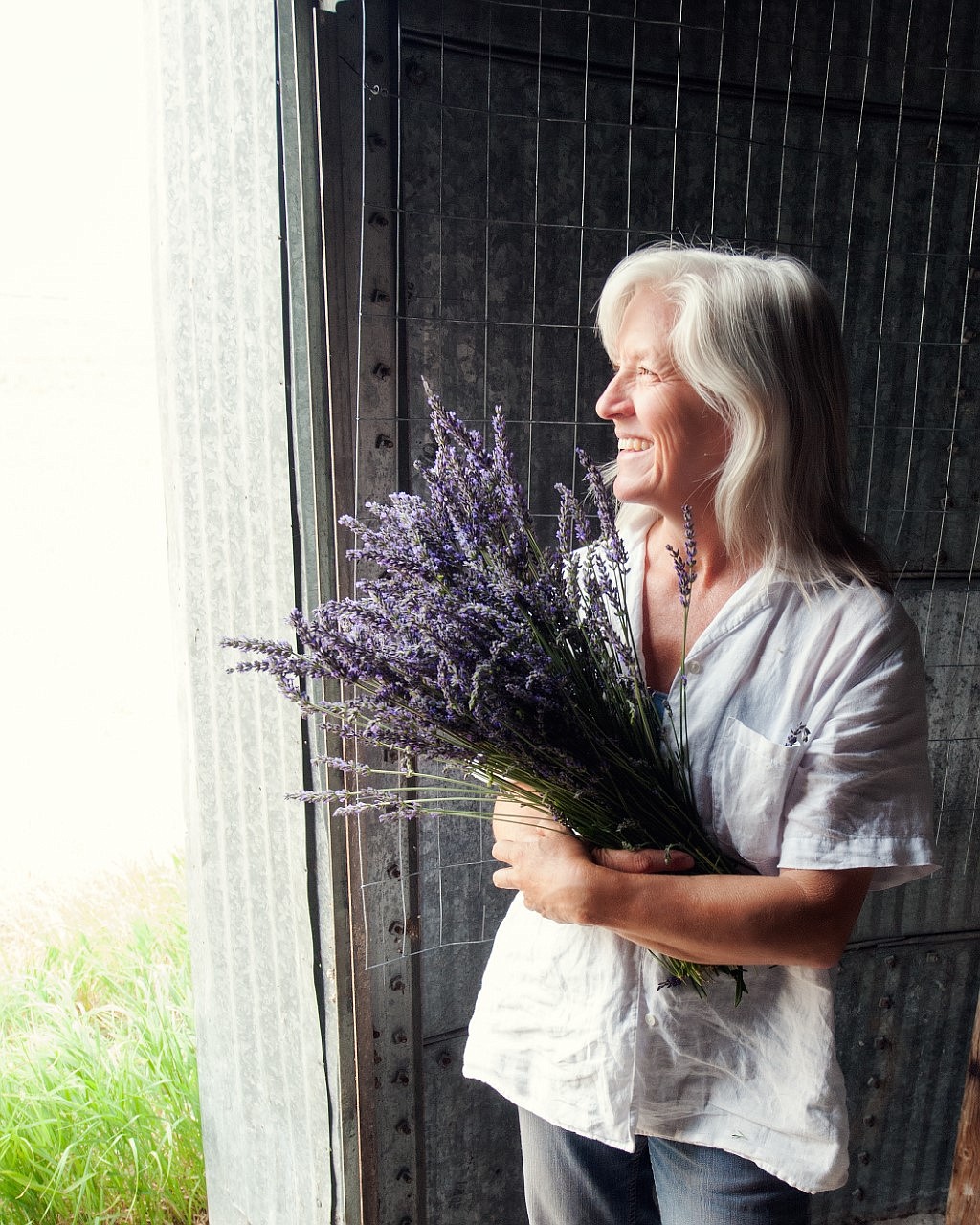 Lori Parr holds a bunch of lavender at her place near St. Ignatius.