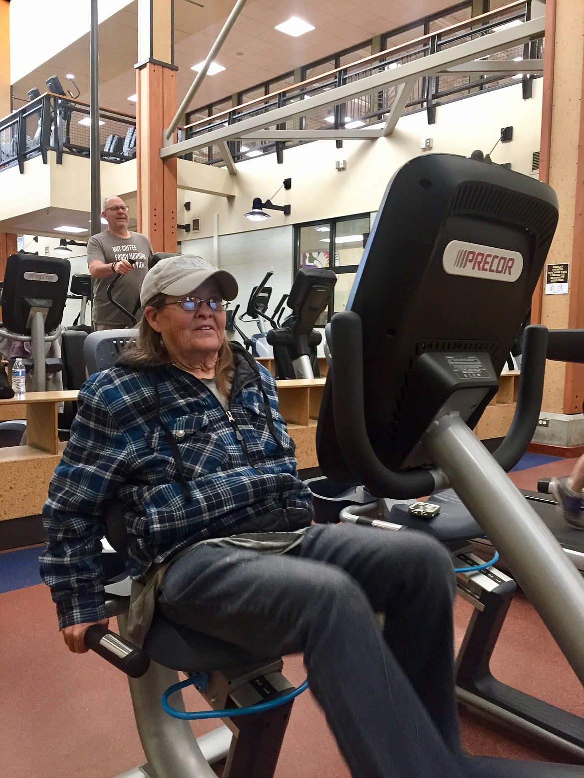 Sandy Howe peddles a stationary bicycle at the Kroc on Saterday. As a Kroc Center regular, she was so happy to be back in her routine. (JENNIFER PASSARO/Press)