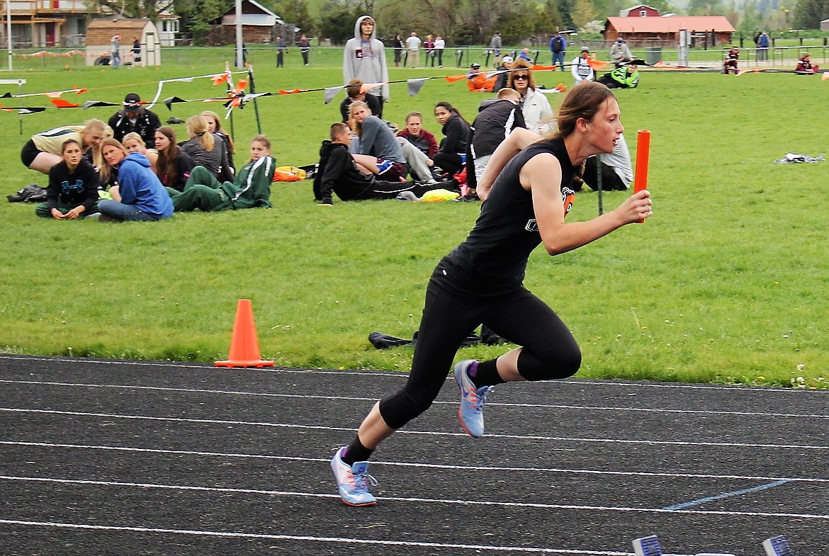 Ronan senior sprinter Kinsley Barney competes in a 400 meter relay race in May 2017. Barney recently committed to Rocky Mountain College. (File photo)