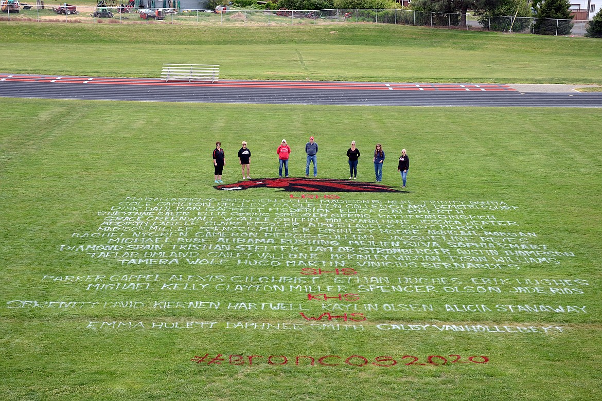 KD Consulting, LLC/courtesy photo
(From left to right) Julie Hartz, Janet Phillips, Rita Fryberger, Tyler Fryberger, Kris Robbins, Michelle Smith and Lisa Cox stand by the art project on Lind-Ritzville High School’s football field to honor 2020 seniors
