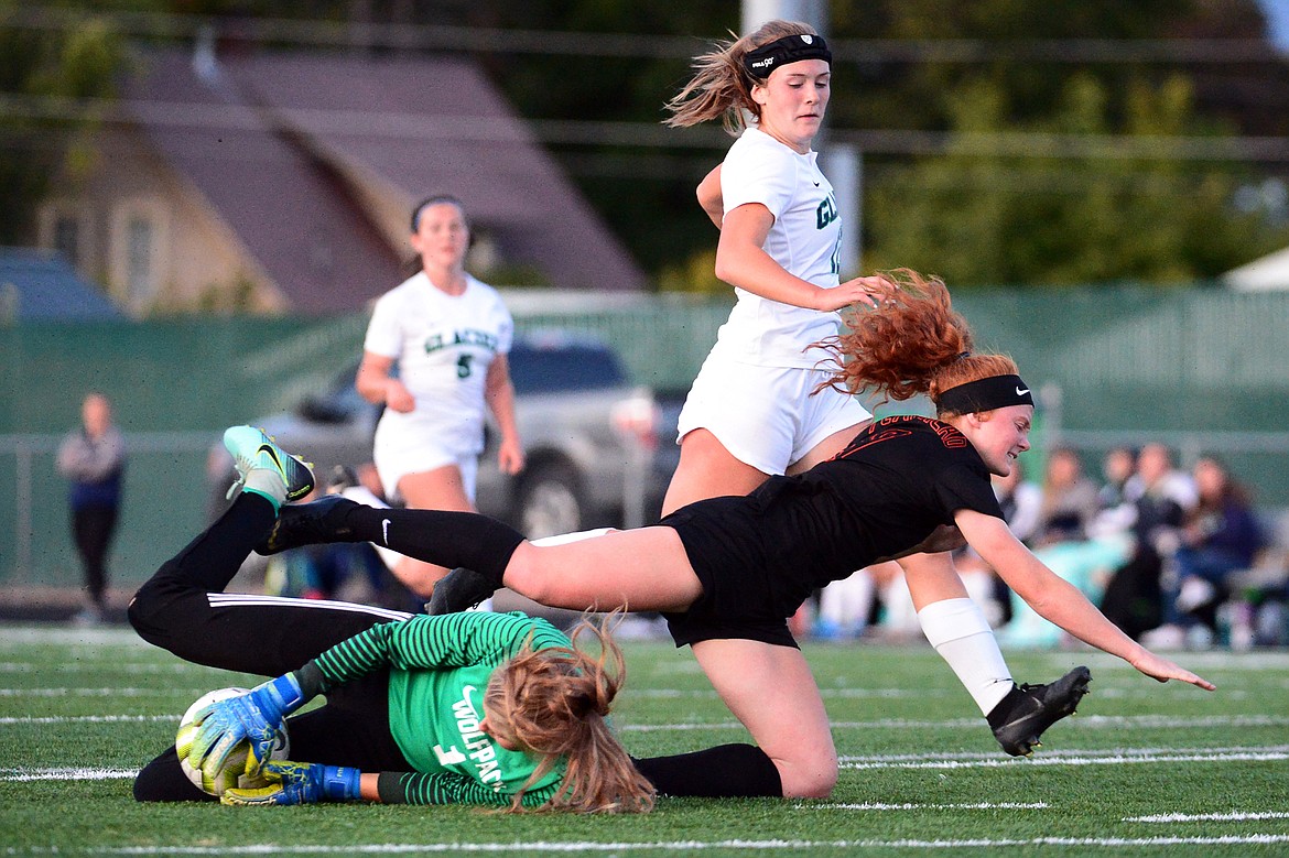 Glacier goalkeeper Sophie Smith (1) makes a save against Flathead's Skyleigh Thompson (9) during crosstown soccer at Legends Stadium on Tuesday, Sept. 24, 2019. (Casey Kreider/Daily Inter Lake)
