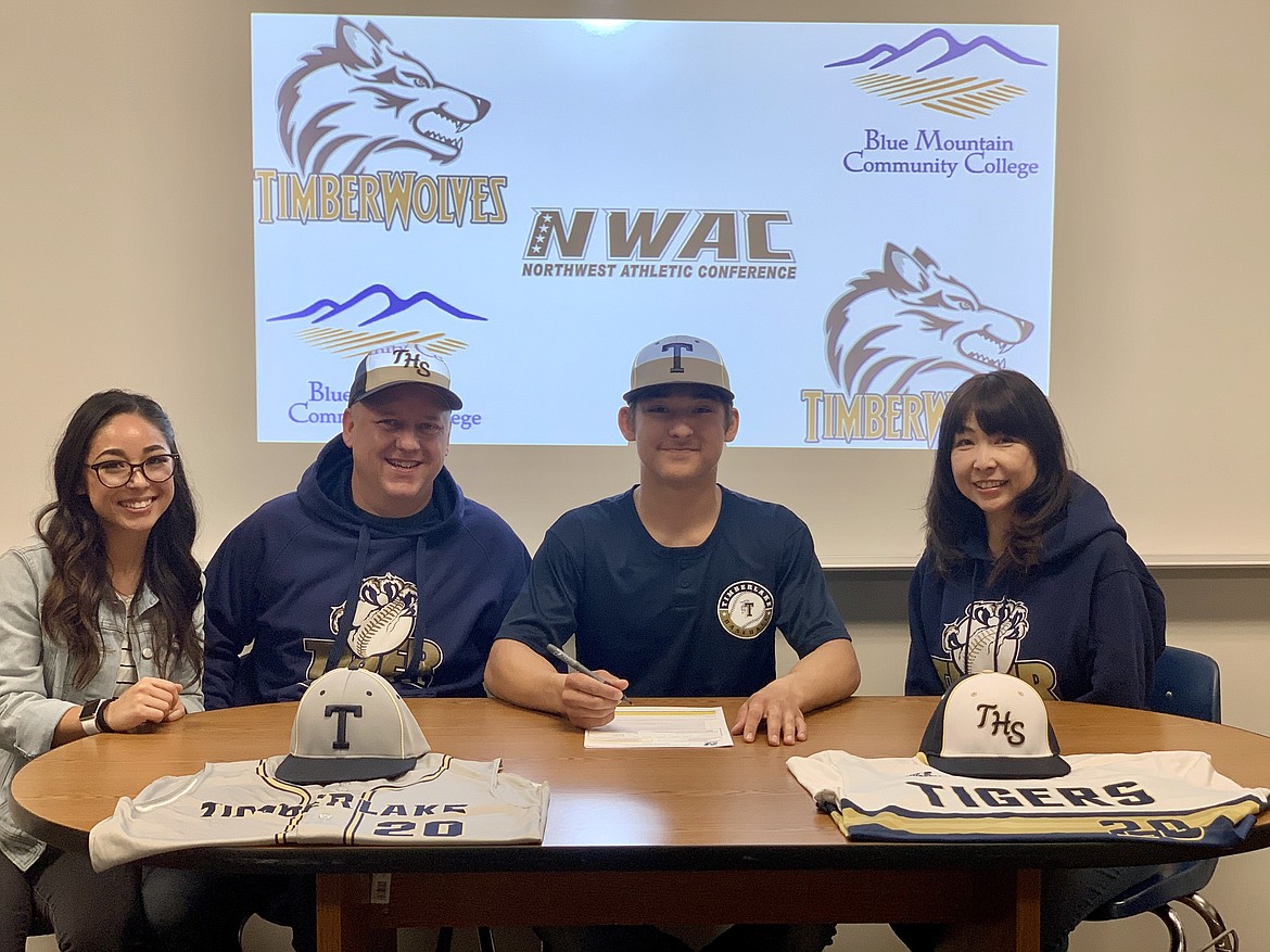 Timberlake High senior Louis Powell recently signed a letter of intent to play baseball at Blue Mountain Community College in Pendleton, Ore. From left are Reina Powell (sister), Jeff Powell (dad), Louis Powell and Reiko Powell (mom).