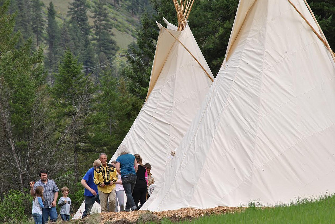 Sheep Mountain Lodge owner Perry Jones, and lodge host Isaiah McGuffey, along with his children, gather with the crew from Alpine Tipi’s following the smudging ceremony.  (Amy Quinlivan/Mineral Independent)