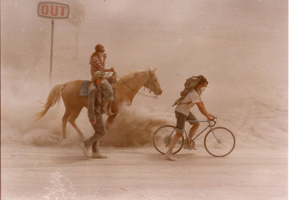 The ash dropped on Grant and Adams counties by the eruption of Mount St. Helens caused people to turn to alternative modes of transportation, like these folks heading south on Stratford Road.