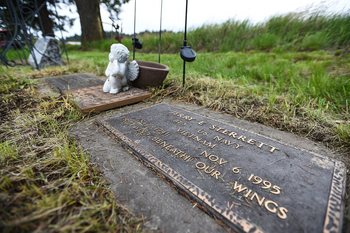 The gravestone of Jerry E. Sterrett, a U.S. Navy veteran of the Vietnam War, is shown at Lone Pine Cemetery in Bigfork on Friday, May 15. (Casey Kreider/Daily Inter Lake)