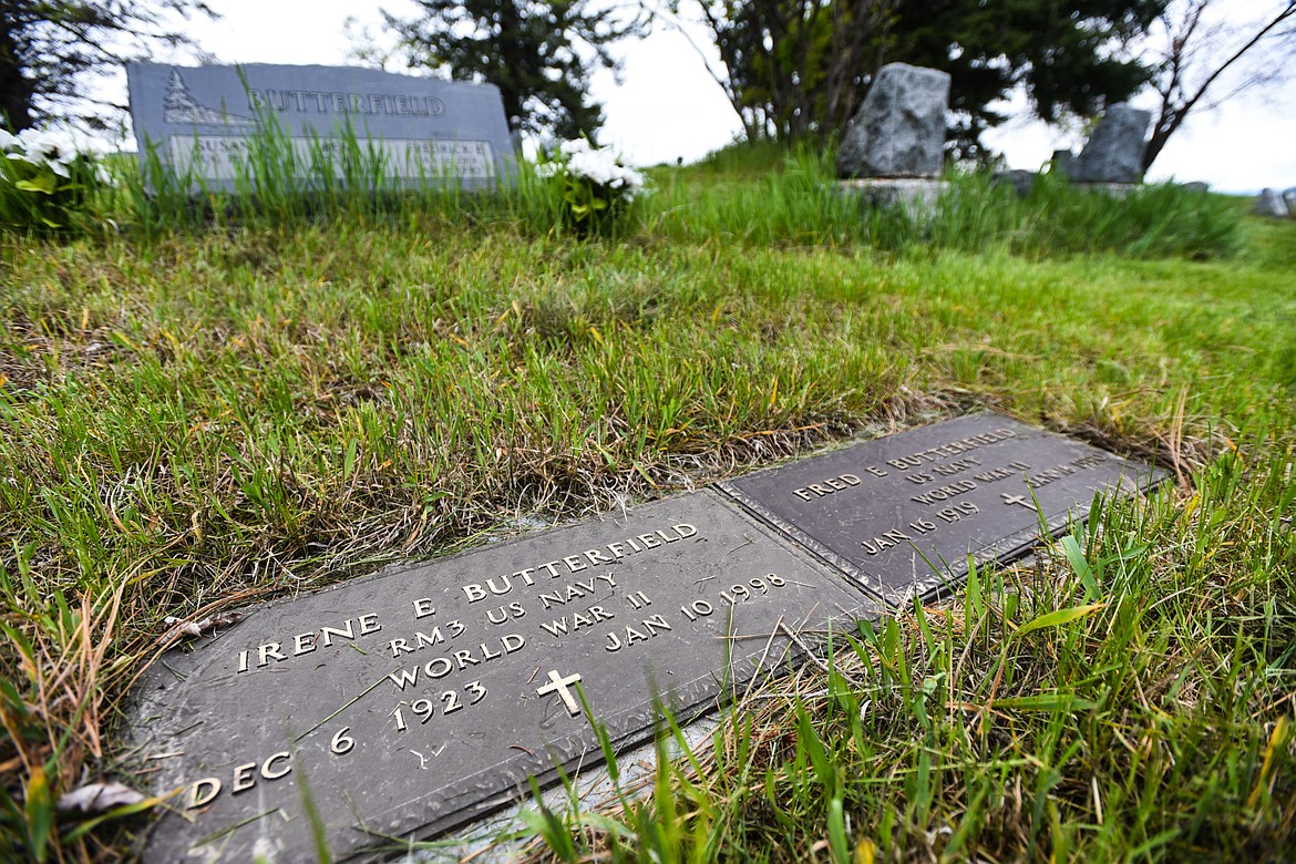 The gravestones of Irene E. and Fred E. Butterfield, U.S. Navy veterans of World War II and husband and wife, at Lone Pine Cemetery in Bigfork on Friday, May 15. (Casey Kreider/Daily Inter Lake)