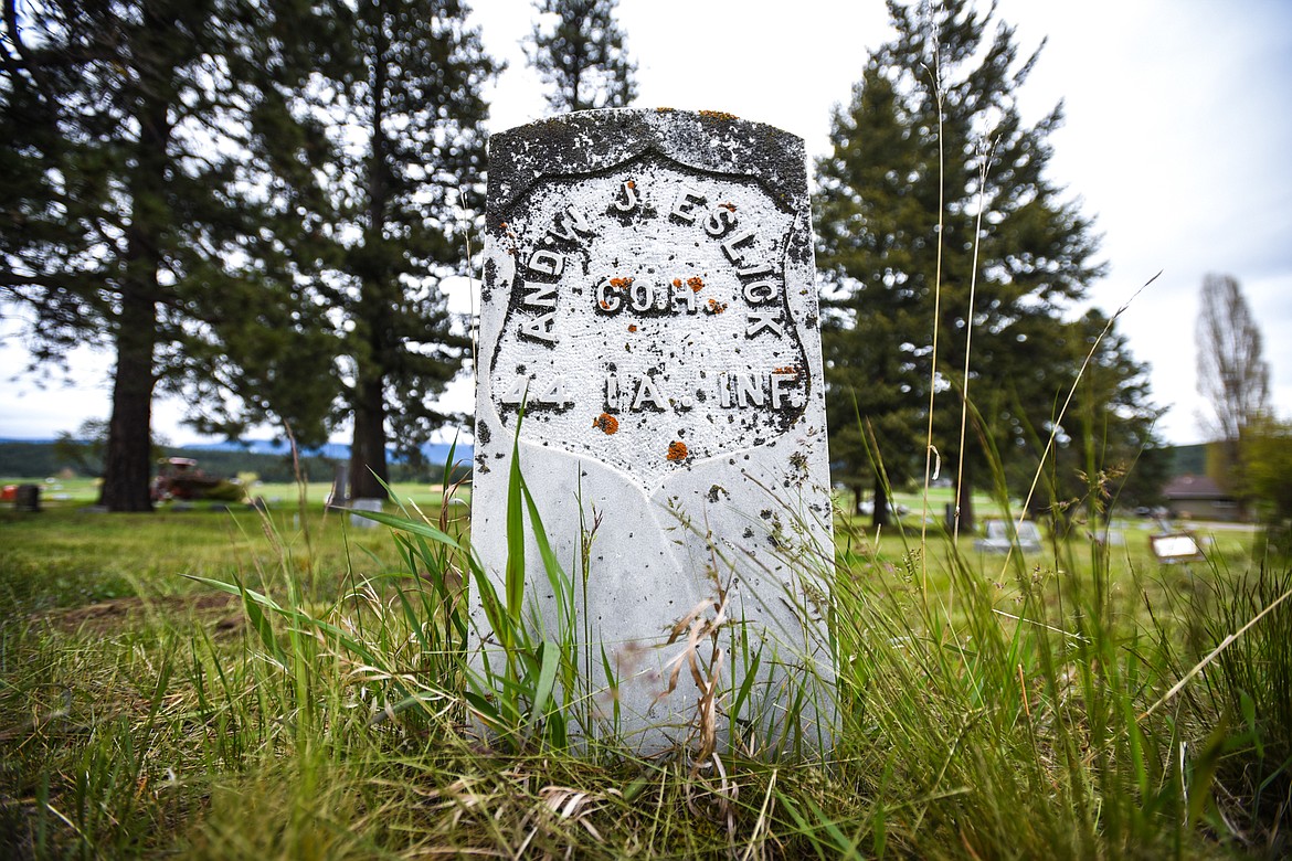 The gravestone of Andrew J. Eslick, a U.S. Army veteran of the Civil War, at Lone Pine Cemetery in Bigfork on Friday, May 15.