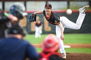 Kalispell Lakers AA starting pitcher Kostya Hoffman throws to Glacier Twins A’s Stevyn Andrachick in the first inning at Griffin Field on Saturday. (Casey Kreider/Daily Inter Lake)
