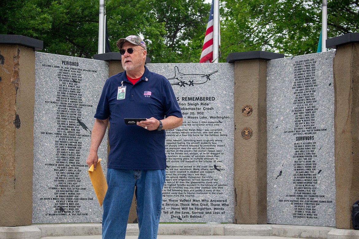 Organizer Larry Godden welcomes attendees to a remembrance service Monday for 87 military service members killed in a 1952 air crash at Larson Air Force Base in Moses Lake.
