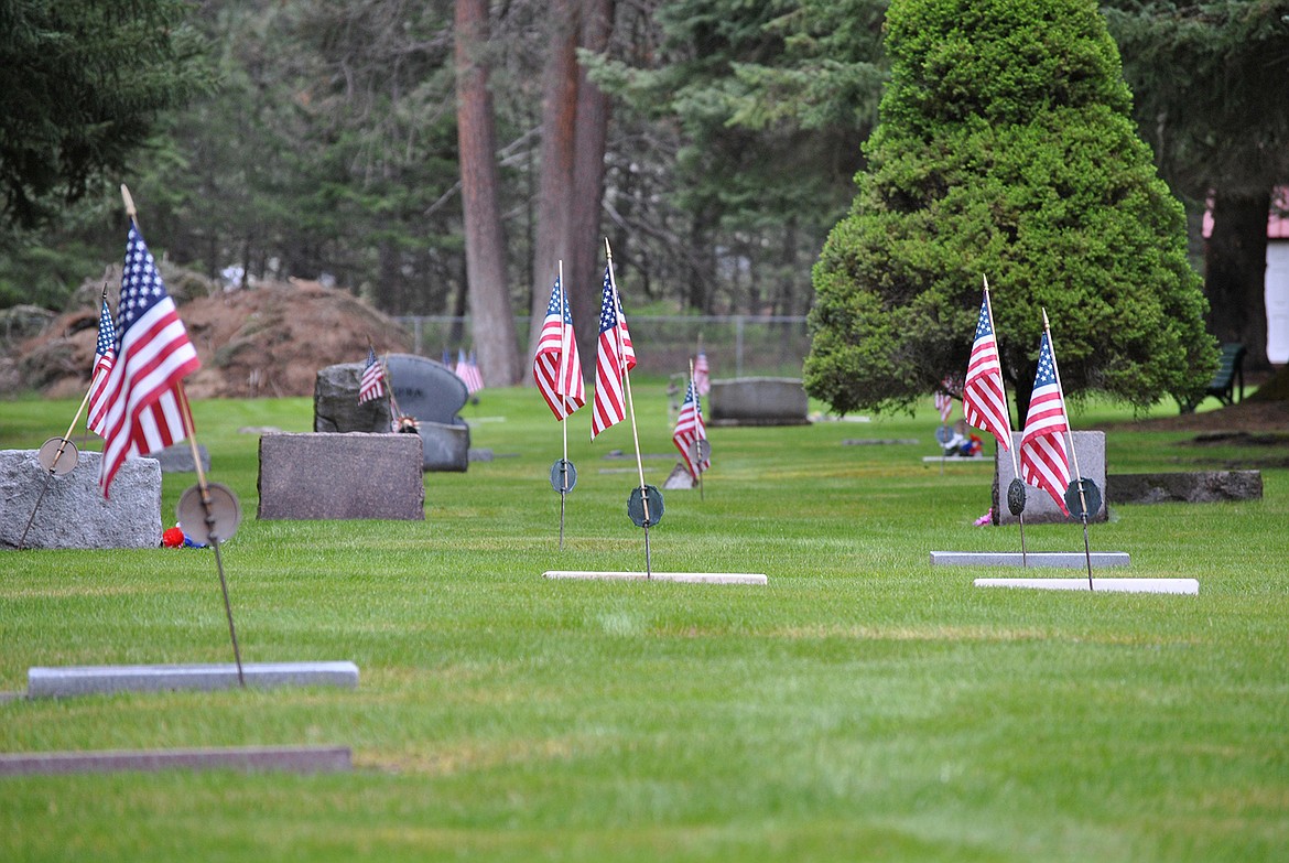 American flags commemorate numerous gravesites recognizing the many veterans at the St. Regis Cemetery over Memorial Day weekend. (Amy Qunlivan/Mineral Independent)