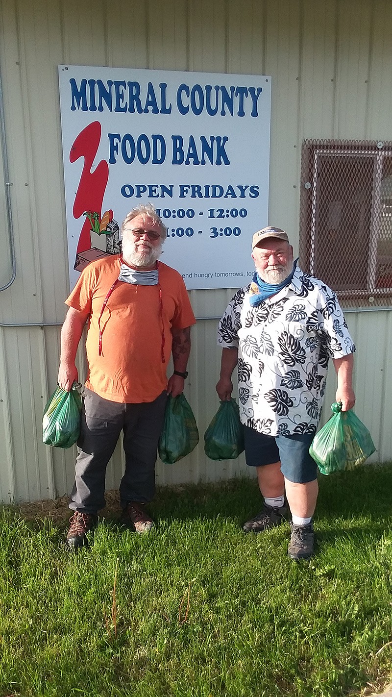 Joint Operation Mariposa’s David Williams and Rep. Denley Loge helped distribute potatoes to those in need recently. (Monte Turner/Mineral Independent)