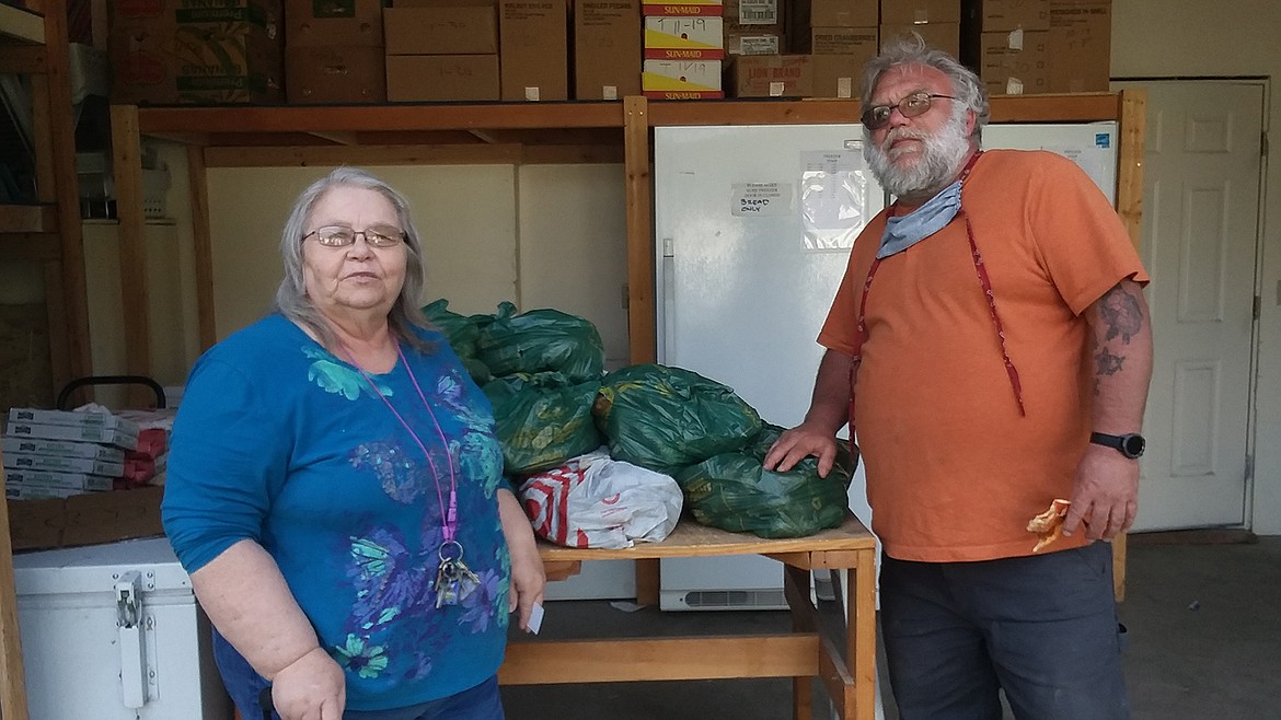 Marleen Adair, Mineral County Foodbank, and David Williams, Joint Operation Marisopa, display some of potatoes which were donated recently. (Monte Turner/Mineral Independent)