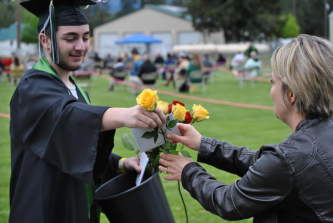 Former guidance counselor April Quinlan receives special recognition from St. Regis 2020 graduate Zechariah Flandreau. (Amy Quinlivan/Mineral Independent)