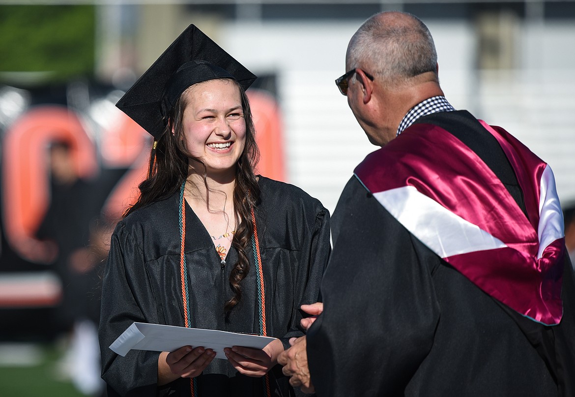 Graduate Alla Kigilyuk receives her diploma from superintendent Mark Flatau at the Flathead High School Class of 2020 commencement ceremony at Legends Stadium on Friday, May 29. (Casey Kreider/Daily Inter Lake)