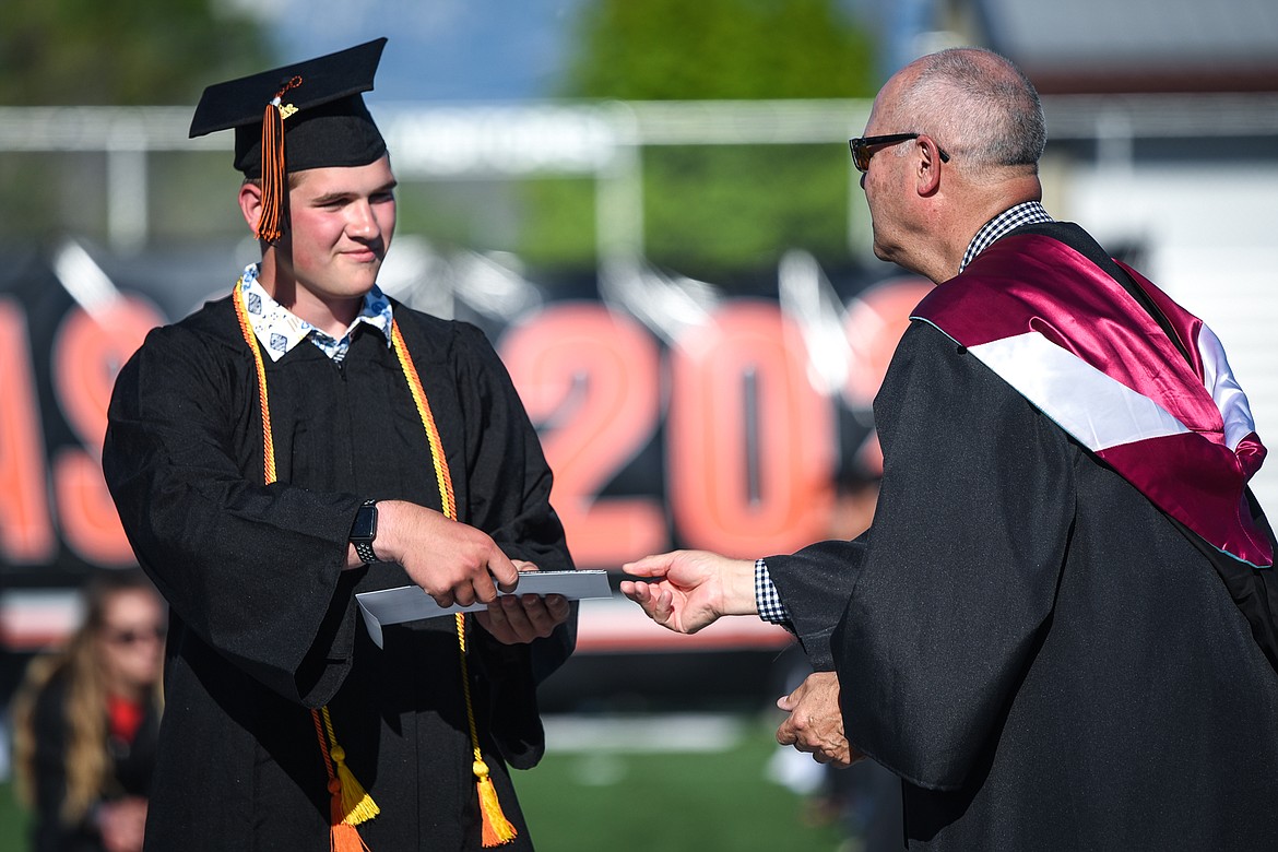 Graduate Neila Danley smiles and gives a thumbs-up after receiving her diploma at the Flathead High School Class of 2020 commencement ceremony at Legends Stadium on Friday, May 29. (Casey Kreider/Daily Inter Lake)