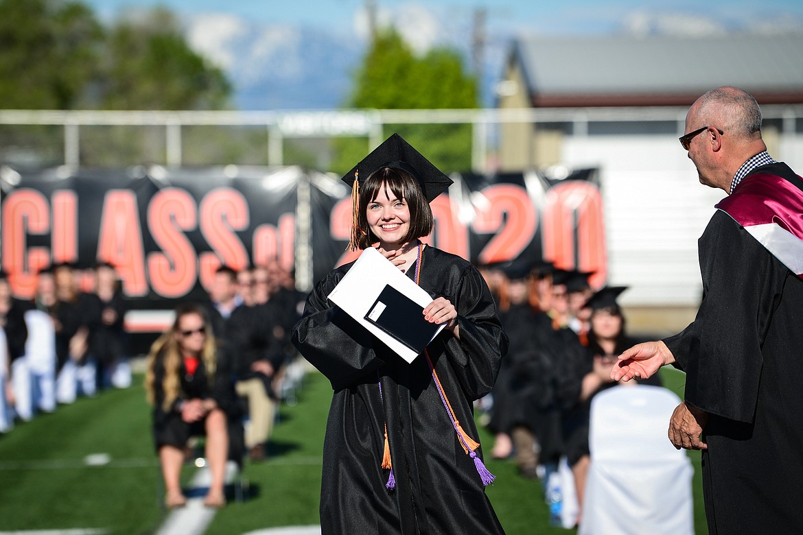 Graduate Neila Danley receives her diploma from superintendant Mark Flatau during the Flathead High School Class of 2020 commencement ceremony at Legends Stadium on Friday, May 29. (Casey Kreider/Daily Inter Lake)