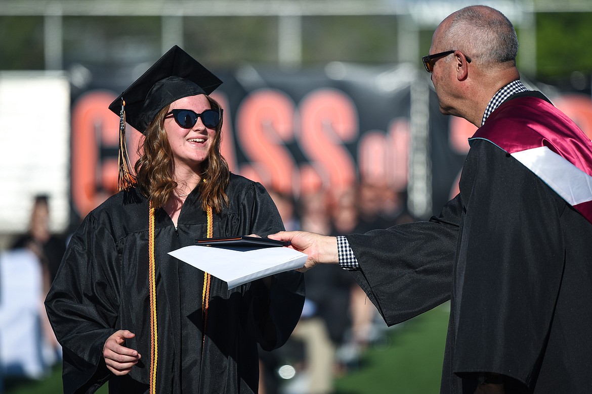 Graduate Jessica Barnhardt receives her diploma from superintendent Mark Flatau at the Flathead High School Class of 2020 commencement ceremony at Legends Stadium on Friday, May 29. (Casey Kreider/Daily Inter Lake)