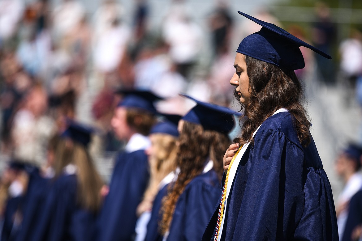 Students listen to a recording of the National Anthem performed by the Glacier Echoes during the Glacier High School Class of 2020 commencement ceremony at Legends Stadium on Saturday, May 30. (Casey Kreider/Daily Inter Lake)
