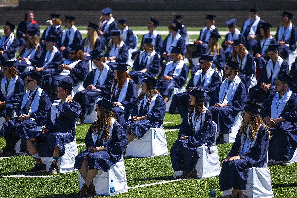 Graduates take their seats spread out across the field at Legends Stadium during the Glacier High School Class of 2020 commencement ceremony on Saturday, May 30. (Casey Kreider/Daily Inter Lake)