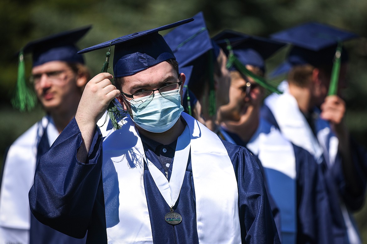 A graduate wears a mask before the start of the Glacier High School Class of 2020 commencement ceremony at Legends Stadium on Saturday, May 30. Students and guests were not required to wear masks but individuals were welcome to use them. (Casey Kreider/Daily Inter Lake)