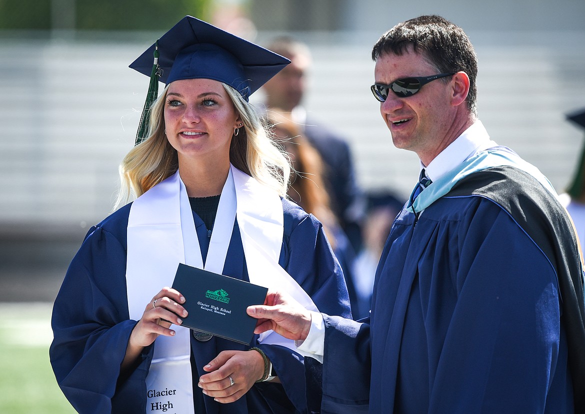 Graduate Madison Alcorn receives her diploma from principal Micah Hill at the Glacier High School Class of 2020 commencement ceremony at Legends Stadium on Saturday, May 30. (Casey Kreider/Daily Inter Lake)
