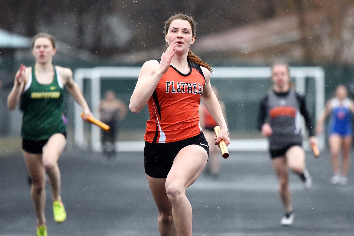 Flathead's Jessica Barnhart competes in the girls' 4 x 100 relay at the Flathead Mini Invite at Legends Stadium on Tuesday, April 9, 2019. (Casey Kreider/Daily Inter Lake)