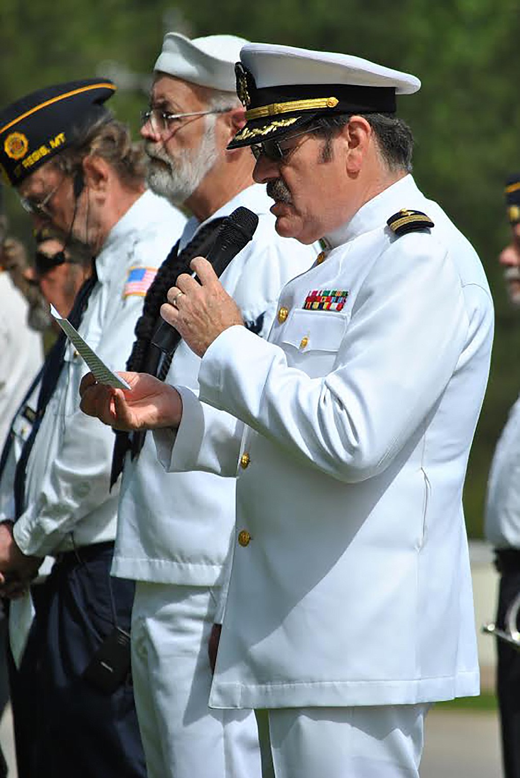 Chaplain Ernie Ornelas prays over the proceedings of the Memorial Day services at Mullan Square. (Amy Quinlivan/Mineral Independent)