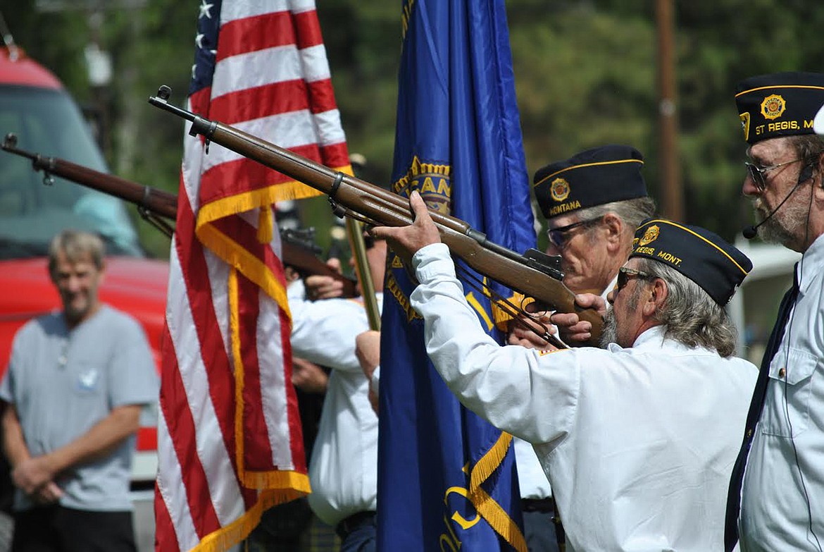 Riflemen Vince Triplett and Dave Carrott, under the direction of Post Adjutant Scott Burrows, gave a three round salute during the Memorial Day Service held at Mullan Square on May 25. (Amy Quinlivan/Mineral Independent)