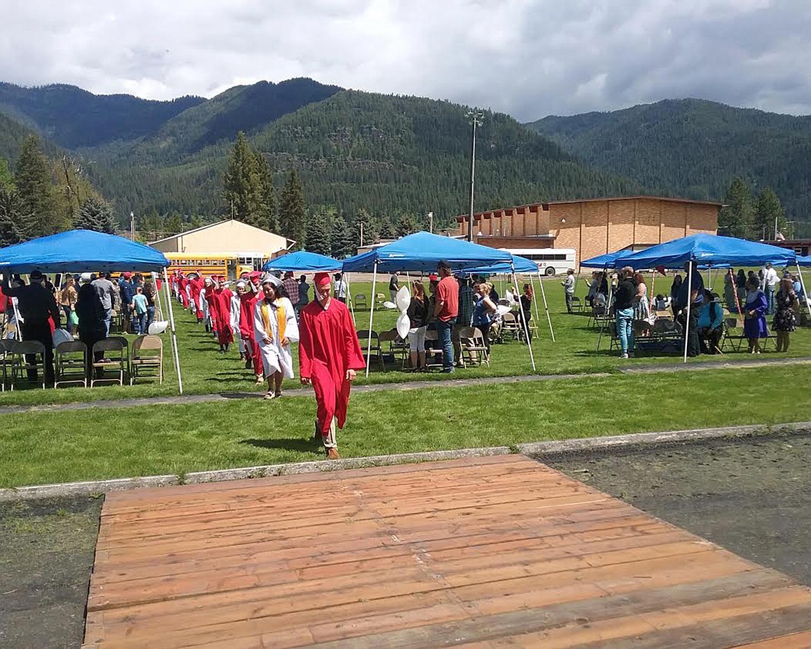 Members of the Class of 2020 walk to the bleachers at the football field for graduation May 24.  (Courtesy photo Noxon School)