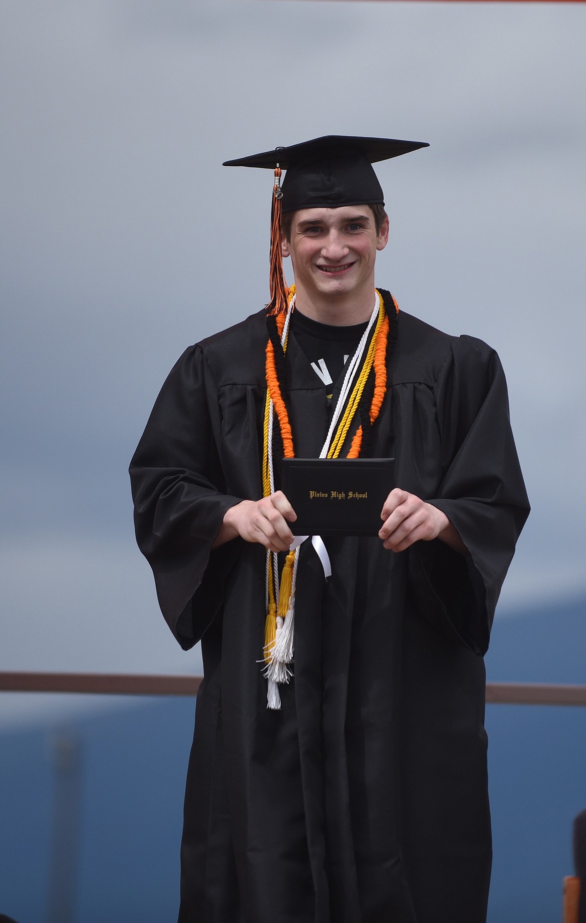 PLAINS GRADUATE Conrad Vanderwall is all smiles after receiving his diploma from Superintendent Thom Chisholm during the ceremony Sunday, May 24 at the high school. (Scott Shindledecker/Valley Press)