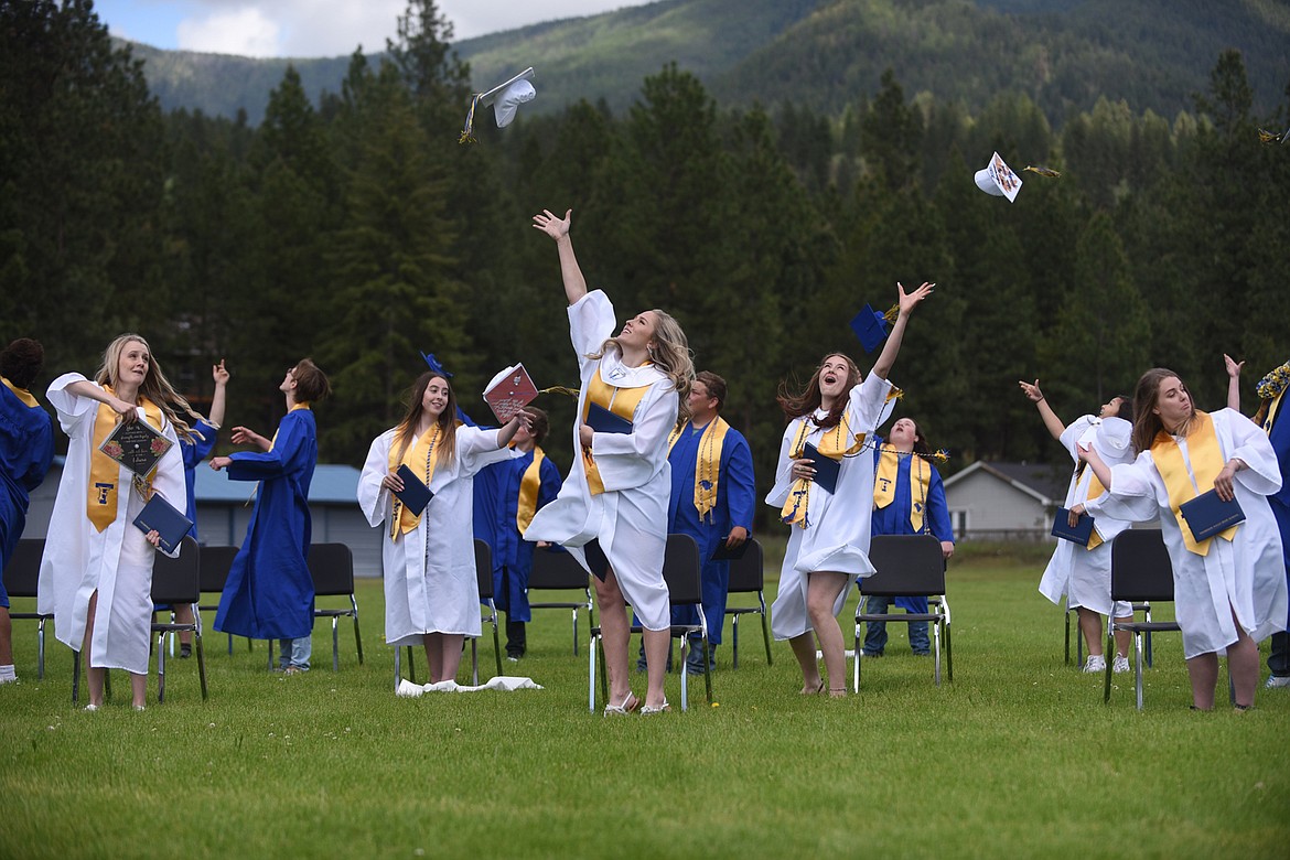 THOMPSON FALLS Class of 2020 graduates celebrate their big day with the cap toss to conclude Sunday’s ceremony. (Scott Shindledecker/Valley Press)