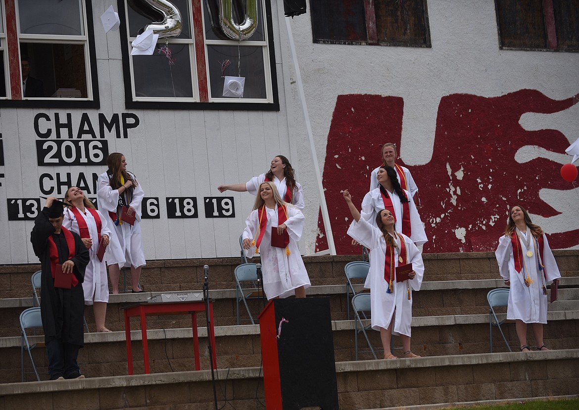 MEMBERS OF the Hot Springs High School Class of 2020 celebrate their graduation with a traditional cap toss during a ceremony on the football field Sunday, May 24. (Scott Shindledecker/Valley Press)