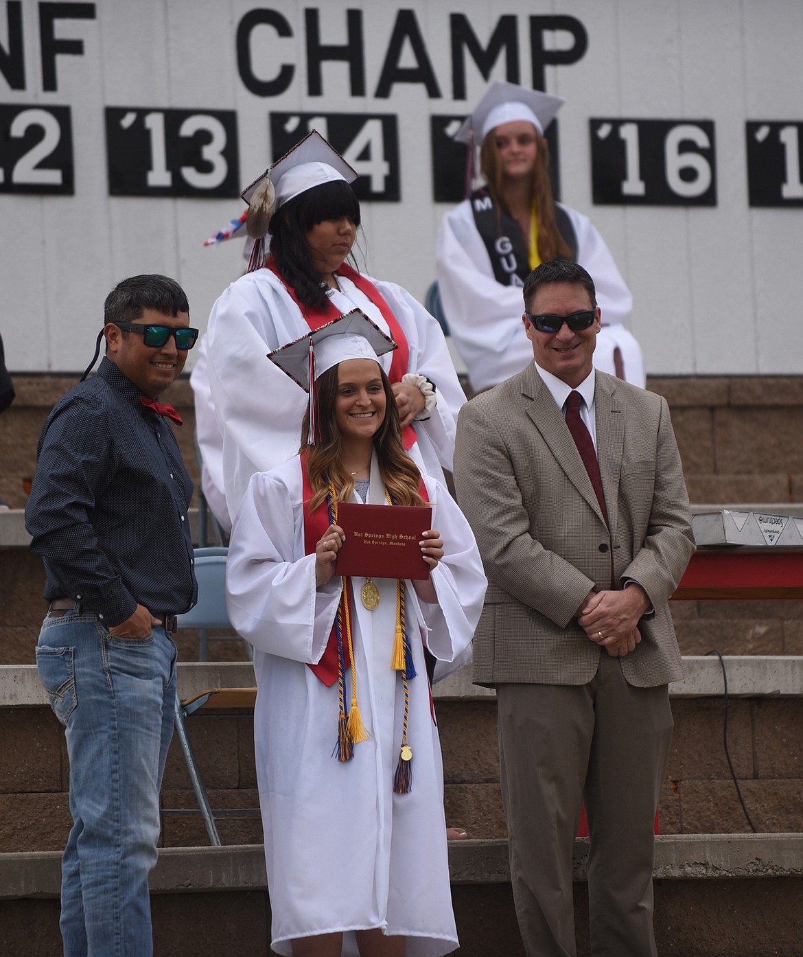 HOT SPRINGS High School valedictorian Jenny Scrivner proudly displays her diploma during graduation ceremonies Sunday, May 24. (Scott Shindledecker/Valley Press)