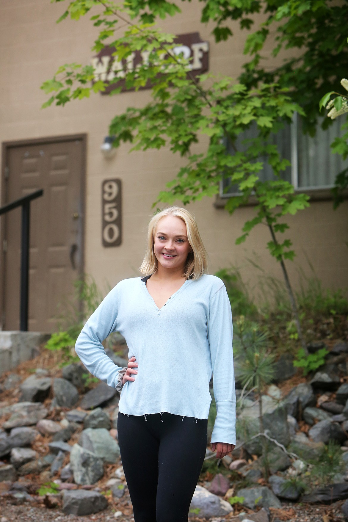 Playhouse acress Ginny Swanson poses for a photo outside her dorm on Monday.