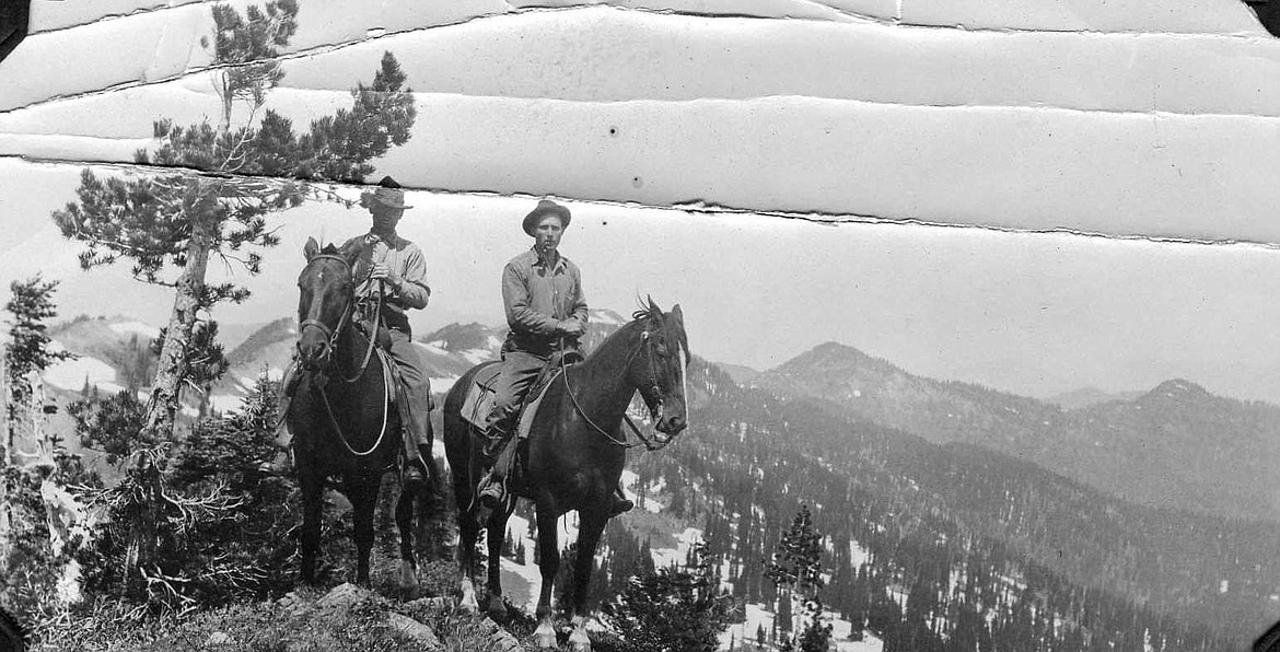 Ranger Thompson & L.G. Hornby on L.O. inspection, On ridge near top of Mtn Aeneas. 
 Courtesy of the U.S. Forest Service