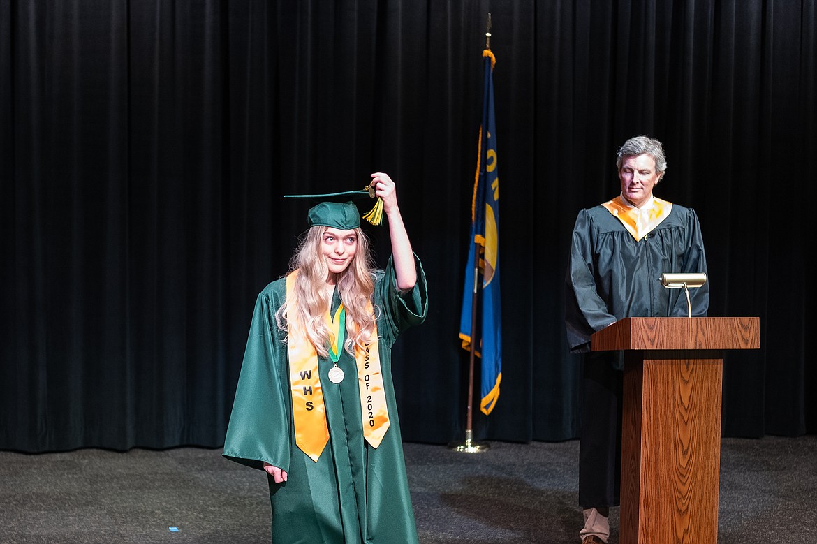 Jordan Hayes switches her tassel during the filming of the 2020 graduation video. (Daniel McKay/Whitefish Pilot)