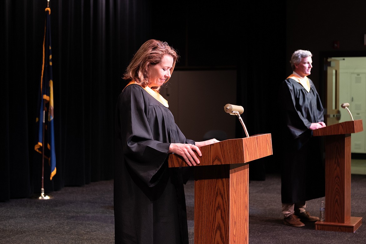 Jacqueline Gaertner and Chris Schwaderer read students' names during the filming of the 2020 graduation video. (Daniel McKay/Whitefish Pilot)