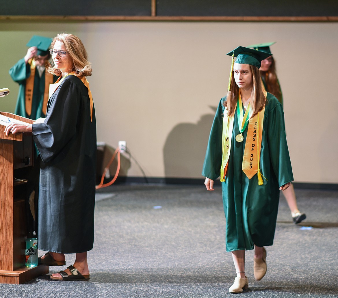 Jessica Henson walks as her name is called during the filming of the 2020 graduation video. (Daniel McKay/Whitefish Pilot)