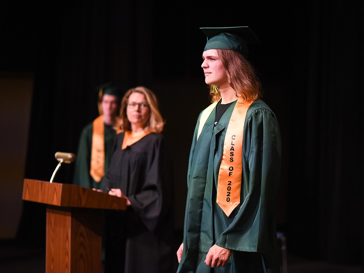 Justin McIntyre pauses after his name is called during the filming of the 2020 graduation video. (Daniel McKay/Whitefish Pilot)